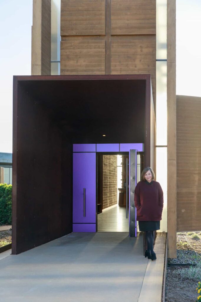 Person in front of entrance to modern building