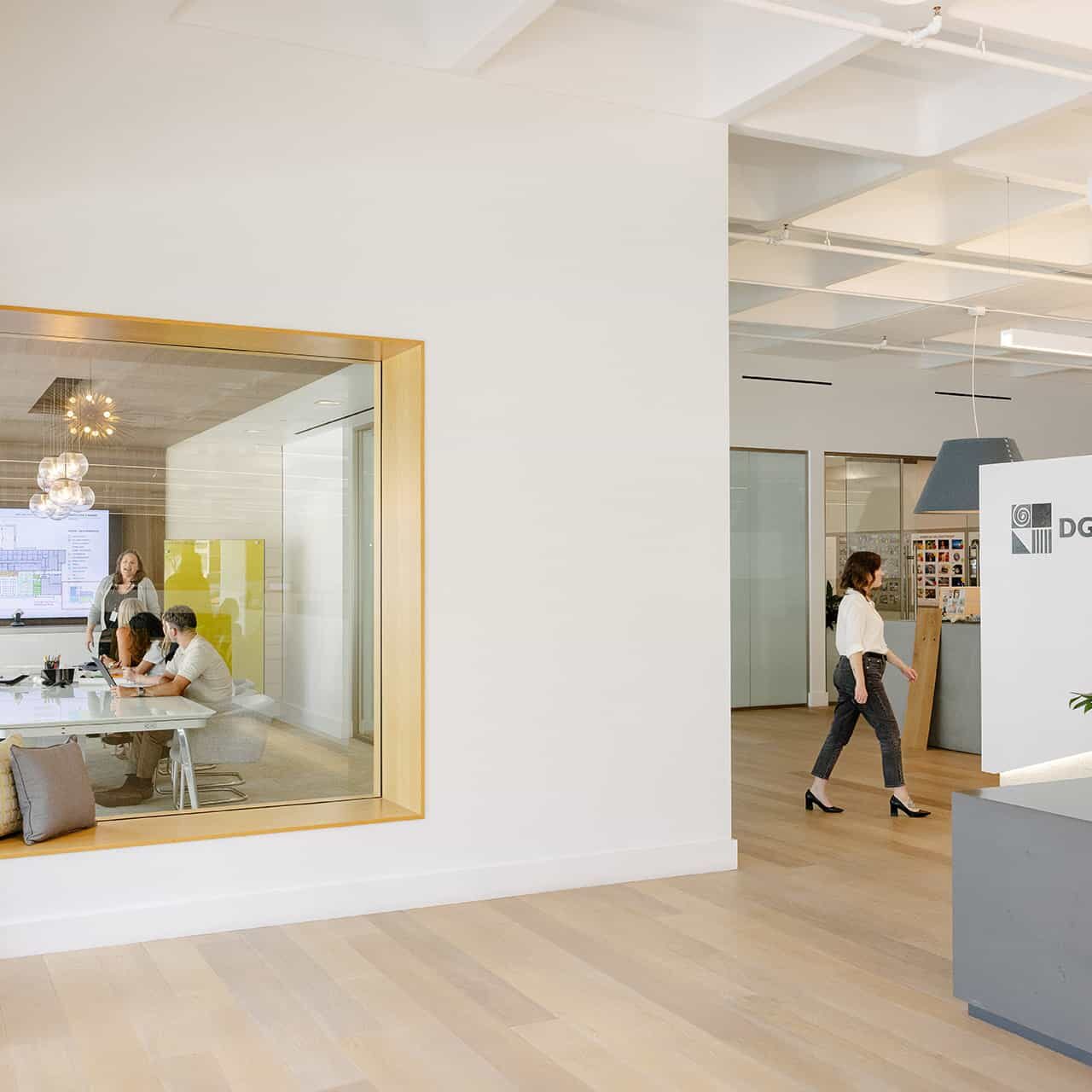 The inside of the DGA San Diego suite includes a modern office space with clean, white walls and large windows