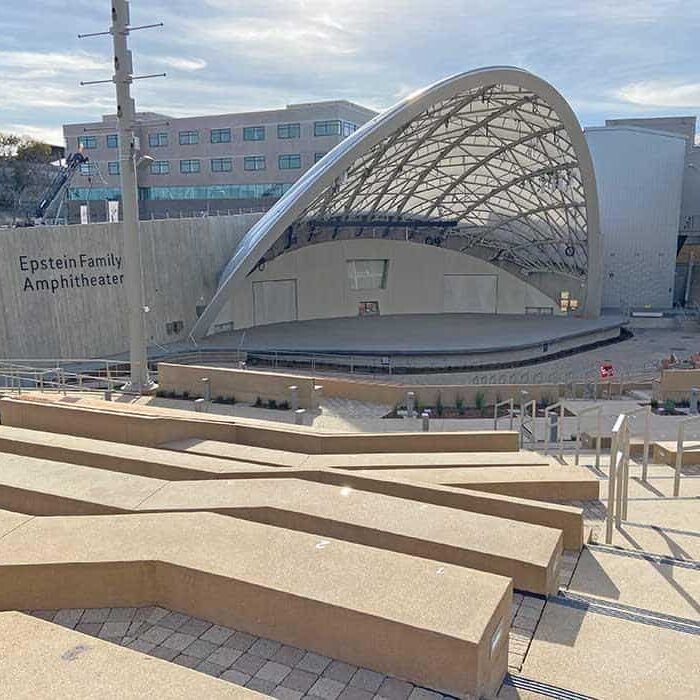 A modern, outdoor amphitheater built using concrete and stone.