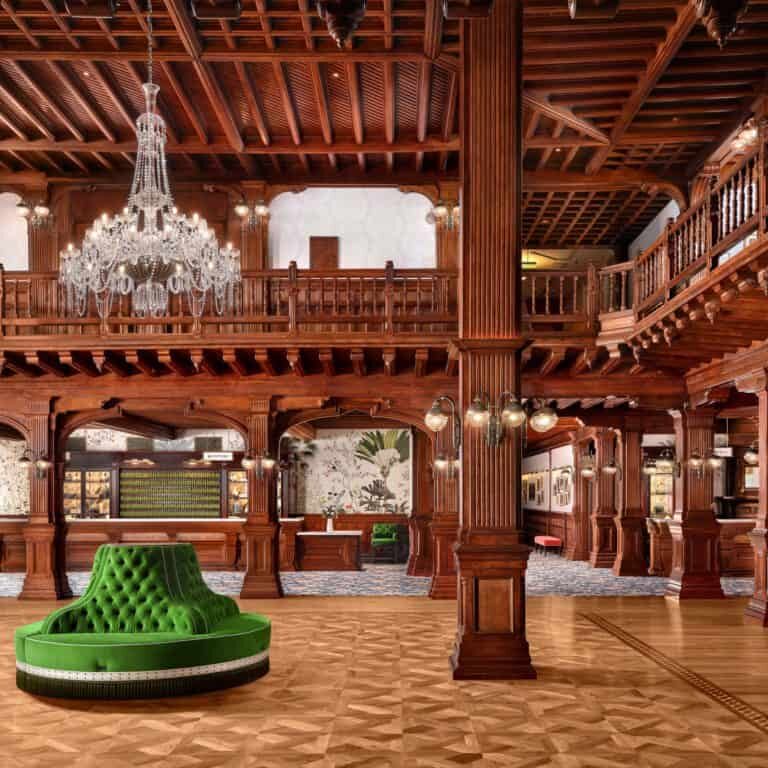 Hotel del Coronado lobby with wood walls and ceiling and a vibrant green sofa