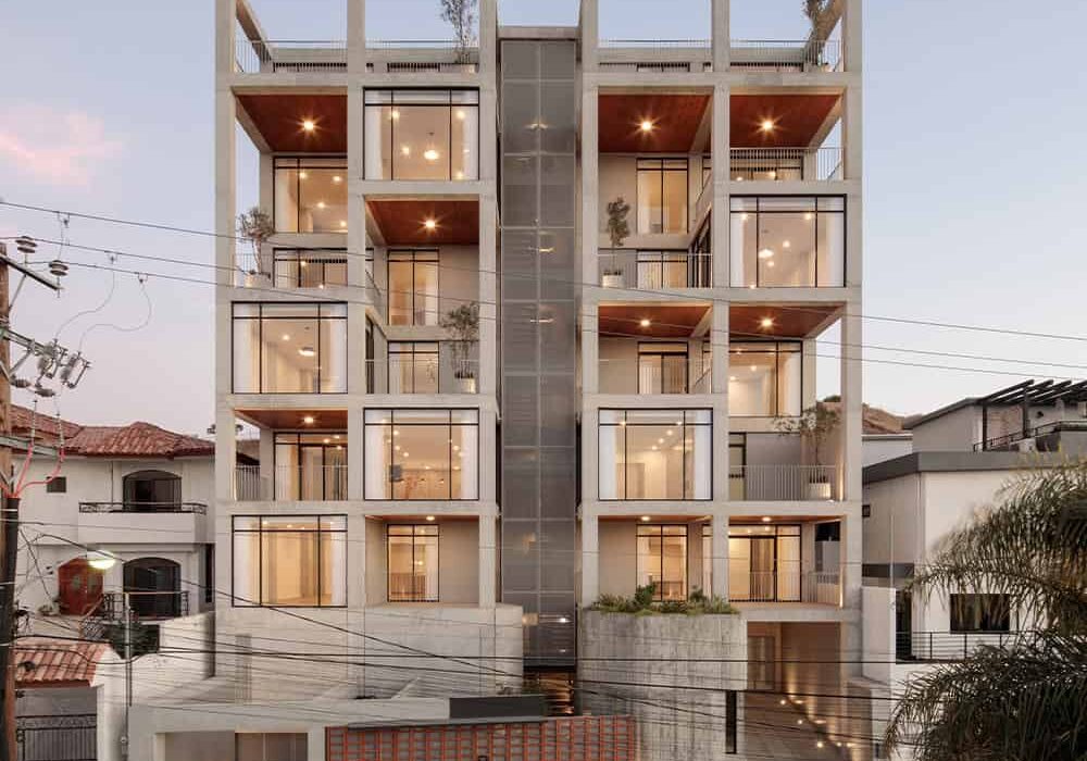 The exterior of Altezza - a modern, concrete apartment building.