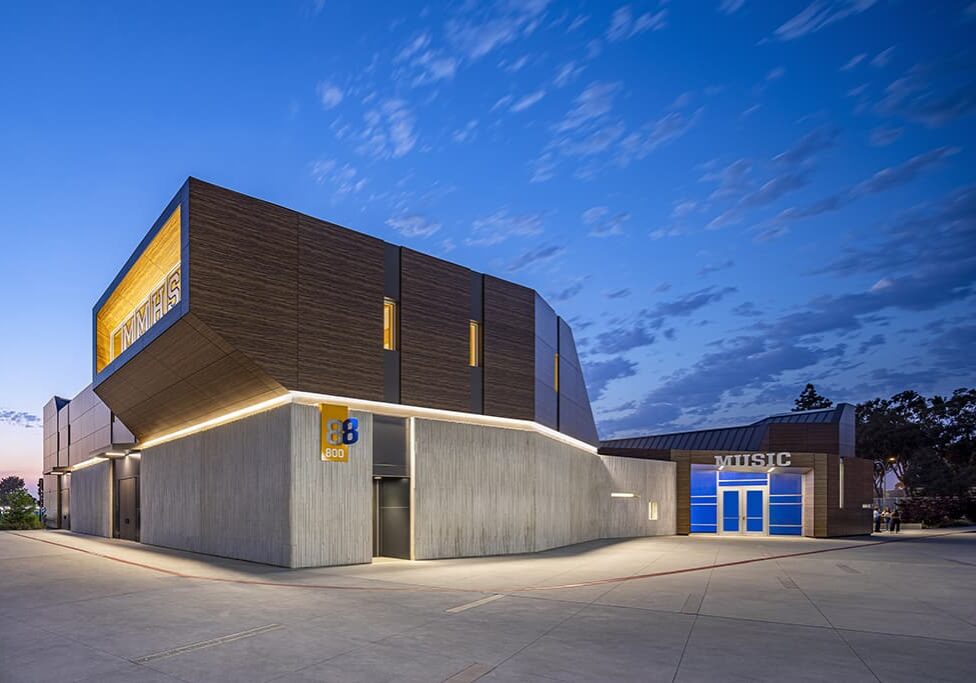 A building with a modern architectural design set against a deep blue sky.